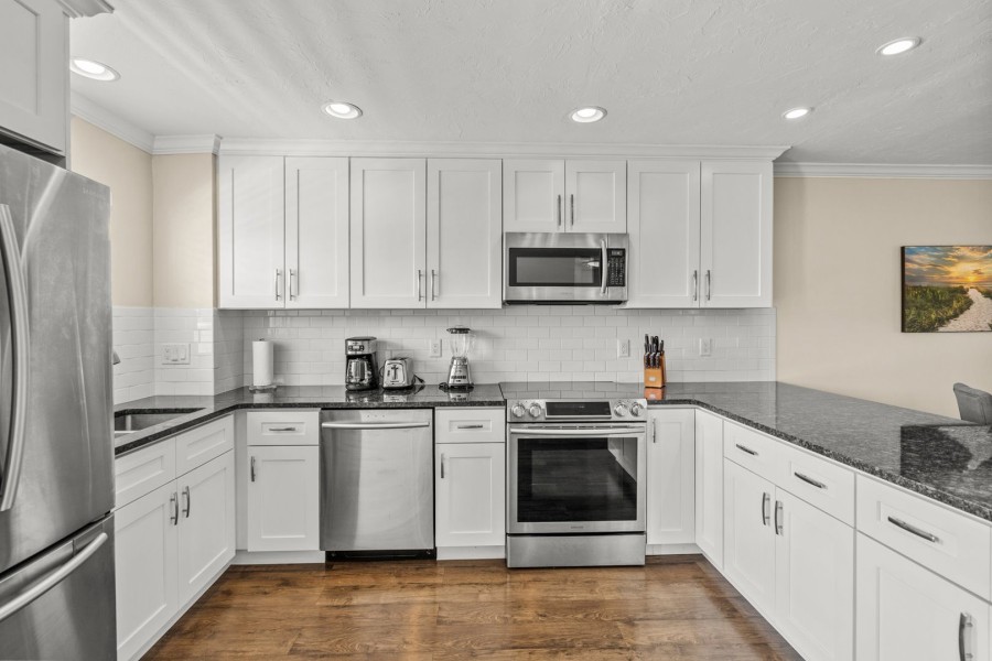 Stainless appliances & quartz counters in the kitchen